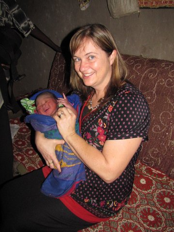 Photo of Robin Pond Byrnes holding a baby